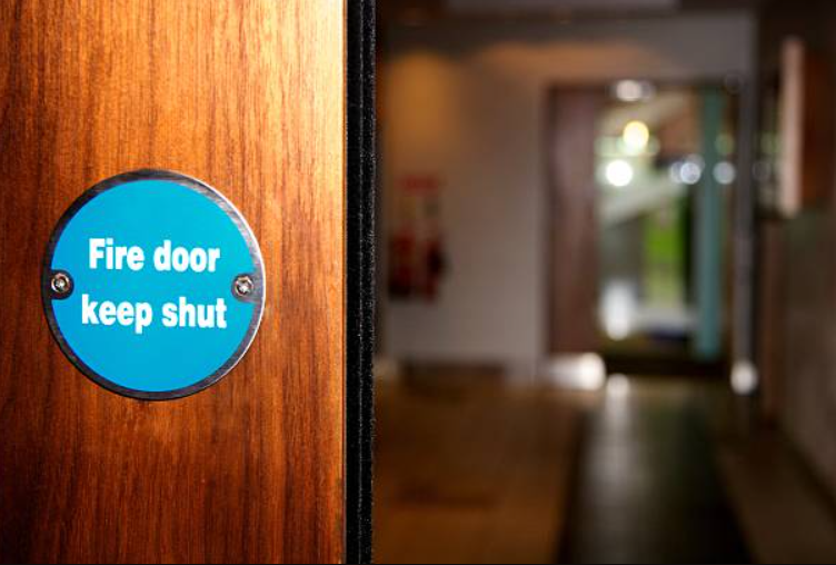 Close up of fire door with sign, keep shut
